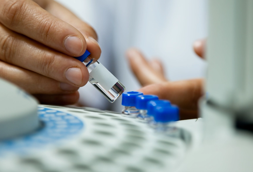 Scientist preparing a sample for cancer therapy treatment, a key step in treating cancer effectively.